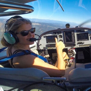 Alicia piloting a plane